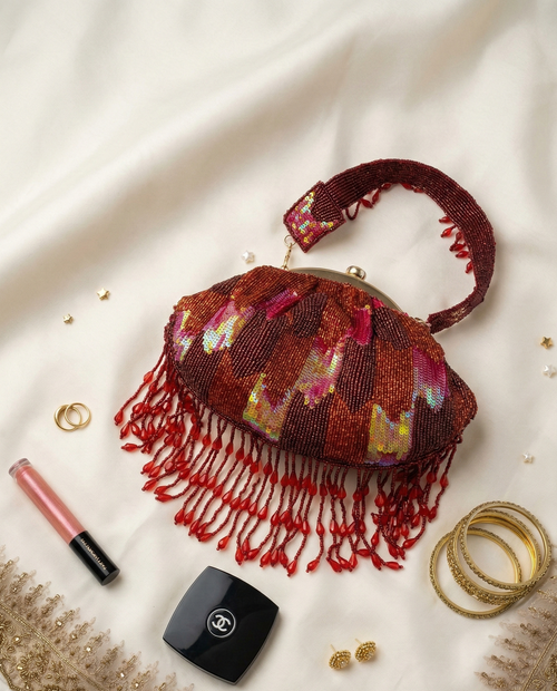 Red beaded Indian potli clutch bag flatlay with sequin detail
