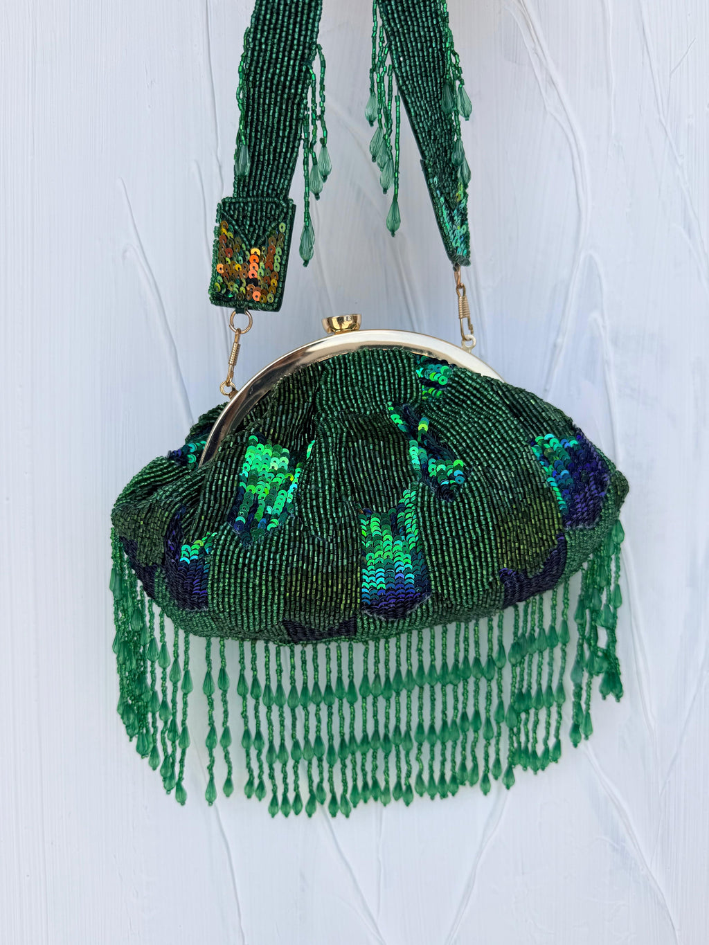 Emerald green beaded Indian statement Potli clutch bag with sequins and fringe detail 