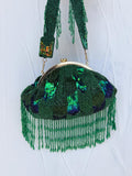Emerald green beaded Indian statement Potli clutch bag with sequins and fringe detail 