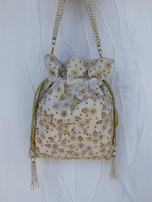 Ivory Indian potli bag with gold thread embroidery and sequin floral detail