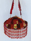 Red beaded bridal potli clutch bag with tassels