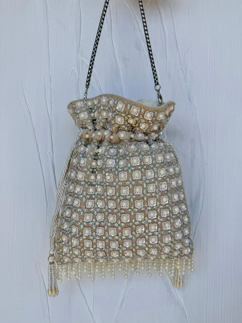 White pearl opal potli bag with iridescent sequin detail and chain strap 